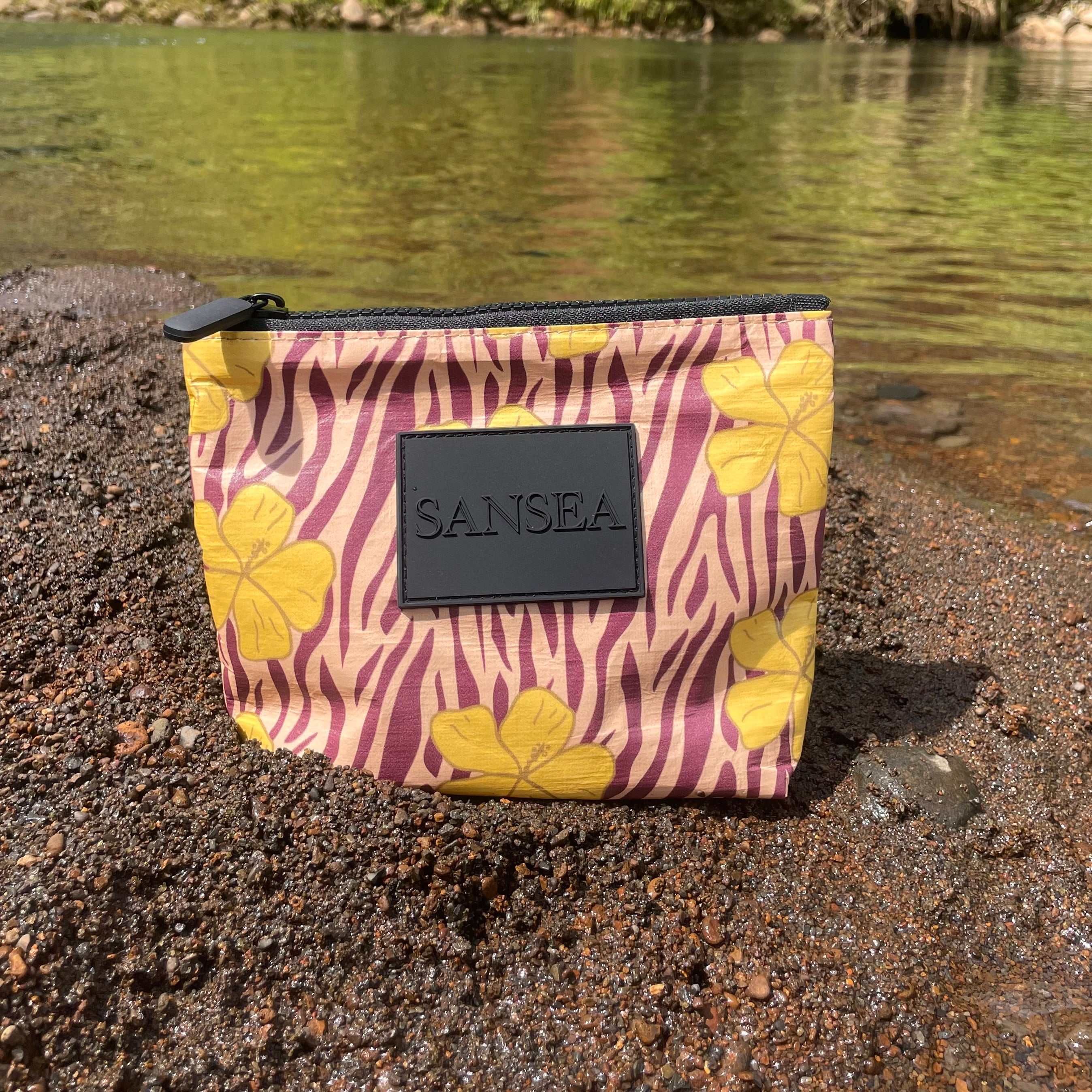 SANSEA TRAVEL POUCH IN GOLDEN HIBISCUS